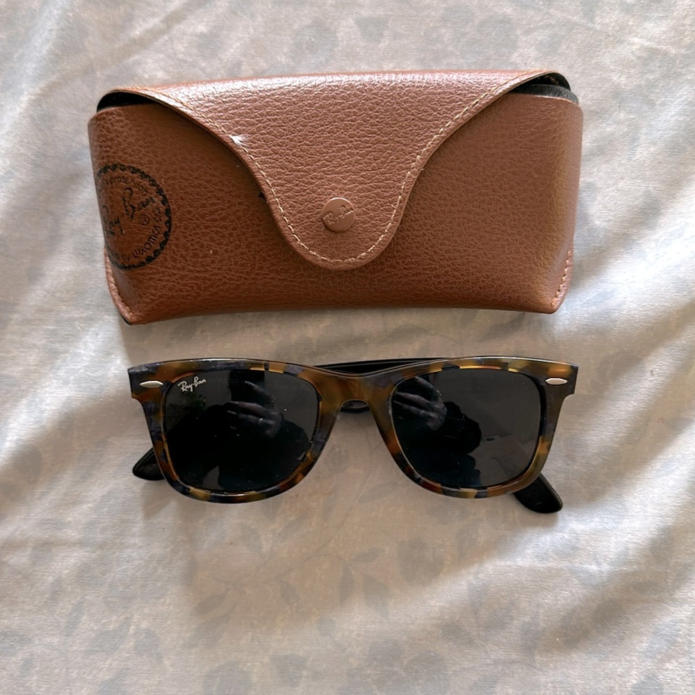 Women’s tortoise shell Ray-Ban sunglasses.